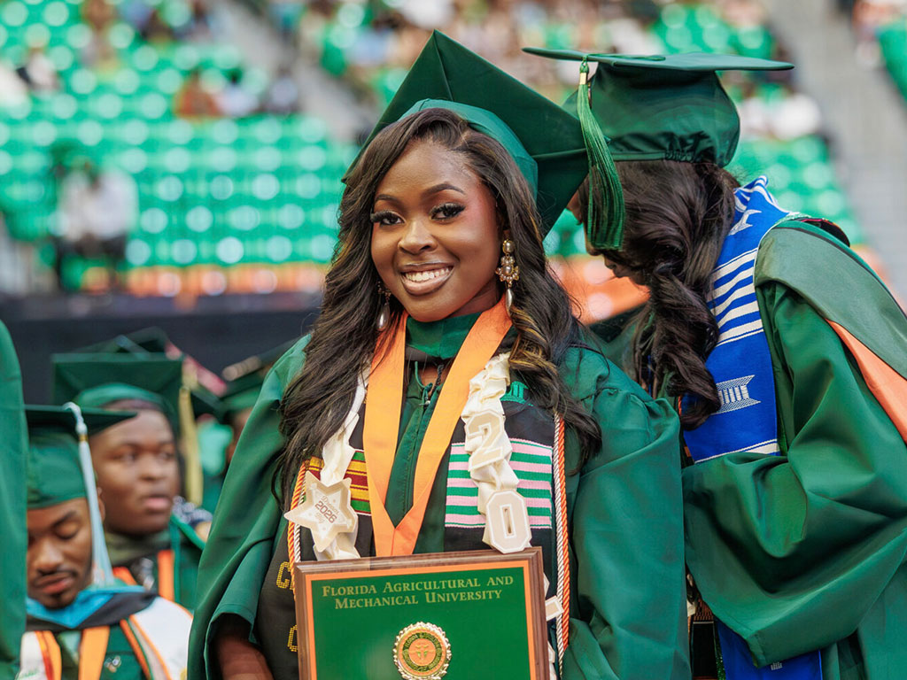 The 119th Miss Florida A&M Edwina Fleurido poses for a photo with a award during the Florida A&M University’s 2026 Spring Commencement at Alfred Lawson Jr. Multipurpose Center on May 1, 2026 in Tallahassee, Florida. (Photo by Jeff Adams/Florida A&M University via Getty Images)